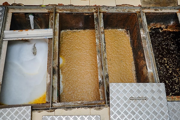 effective methods for grease trap maintenance include regular pumping, scraping, and jetting